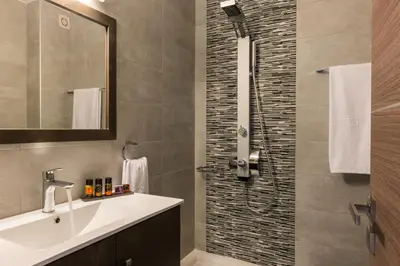 a bathroom with a sink and a shower at Jasmine in Maleme