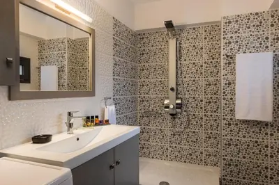 a bathroom with a sink and a shower at Mimosa in Maleme