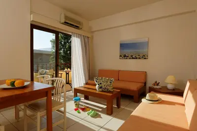 a living room with a couch and a table at Indigo Mare in Plataniás