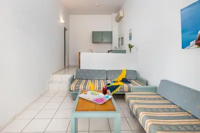 a living room with a couch and a table at Aphea Village in Kolymvari