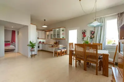 a kitchen and dining room with a table and chairs at Skandalakis Homes & Apartments in Stalos