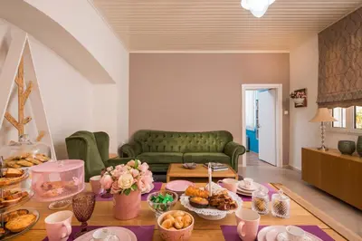 a living room with a table full of food at Casa Arokaria in Pendarianá
