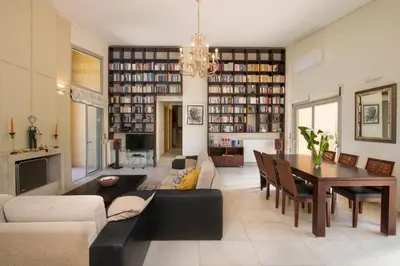 a living room with a couch and a dining room at Gea Maleme in Maleme