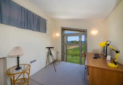 a home office with a desk and a window at Gea Maleme in Maleme