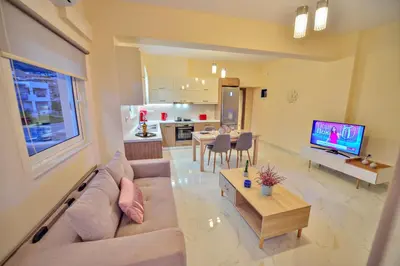 a large living room with a couch and a table at Aristea Apartments in Palaiochóra