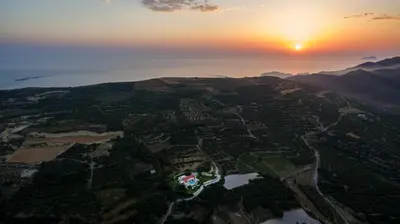 an aerial view of a city at sunset at Villa Elena Chania in Karefilianá