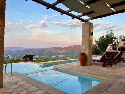 a swimming pool with a view of the mountains at Villa Elena Chania in Karefilianá