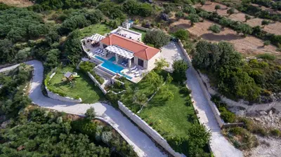 an aerial view of a house with a swimming pool at Villa Elena Chania in Karefilianá