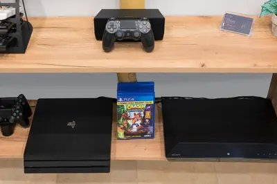 a table with a video game controller and a box at Nidus Villa in Souda