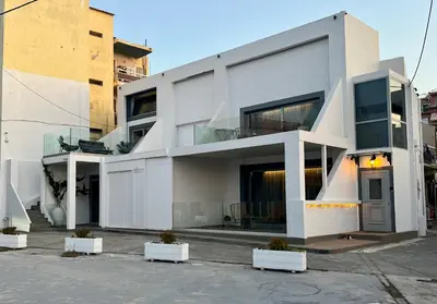 a white building with a lot of windows at Mare suites 1 in Chania Town