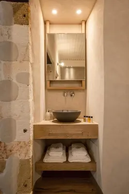 a bathroom with a sink and a mirror at J&G Suites in Chania Town