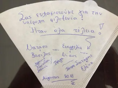 a piece of paper with handwriting on it at Bee House in Kissamos