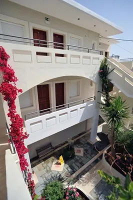 an aerial view of a building with flowers at Merabello Apartments in Agia Marina Nea Kydonias