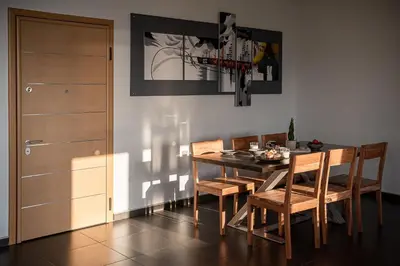 a dining room with a table and chairs at View Point Apartment in Chania Town