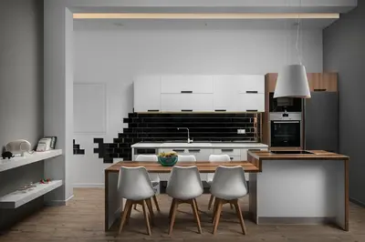 a kitchen with white cabinets and a table and chairs at Villa Sapphire in Almirida