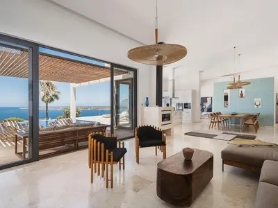 a living room with a view of the ocean at Villa Jamila by Cura Villas Collection in Kalathas