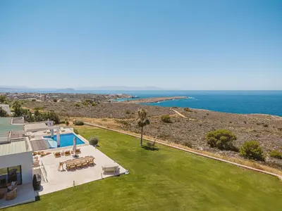 an aerial view of a house and the ocean at Villa Jamila by Cura Villas Collection in Kalathas