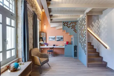an office with a staircase and a desk in a room at 1924 suites in Chania Town