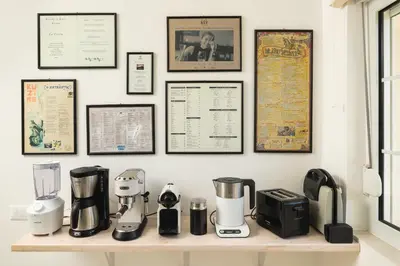 a counter with many appliances on a wall at Seaview Garden Villa - Heated Pool & Sauna in Stalos