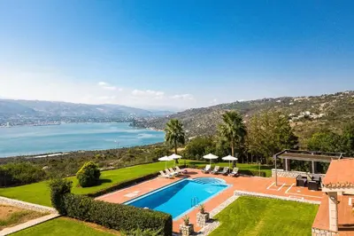 a villa with a swimming pool and a view of the water at Villa Thealassa - Hanging Over the Sea by etouri in Kounoupidhianá