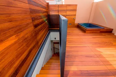 a room with wood flooring and a stair case at Portou House in Chania Town