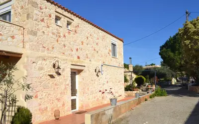 a brick building with a window on the side of it at Rumpis Traditional House in Kambánion