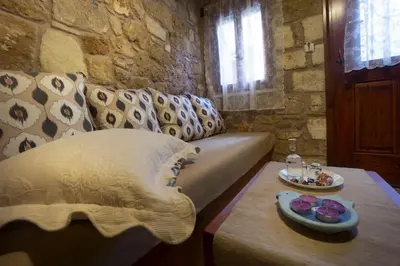 a living room with a couch and a table at Dimitra's House in Old Town in Chania Town