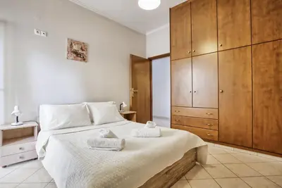 a bedroom with a bed with two towels on it at Gianna's House in Gerani Chanion