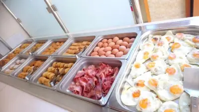 a display case with eggs eggs and other food items at Elektra Beach Hotel in Kalamaki Chanion
