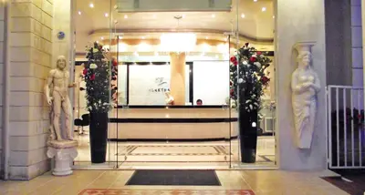 a lobby with a glass door with christmas decorations at Elektra Beach Hotel in Kalamaki Chanion