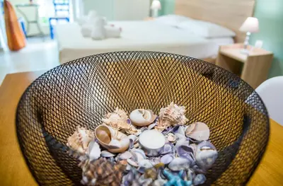 a basket filled with shells on top of a table at Downtown Studio Chania in Chania Town