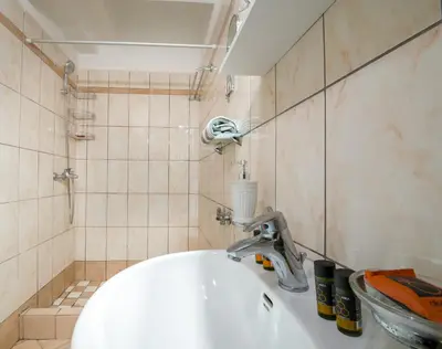 a bathroom with a sink and aaucet at Downtown Studio Chania in Chania Town