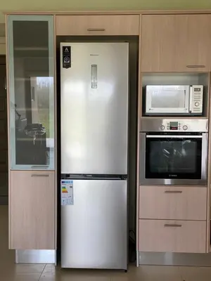 a refrigerator in a kitchen next to a microwave at Stellar Beachhouse in Gerani Chanion