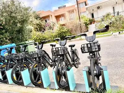 a row of bikes parked next to a street at Solon Apartments in Maleme