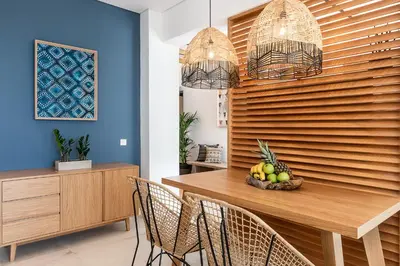 a dining room with a table with a bowl of fruit at Blue Island Luxury Apartment in Kato Daratso