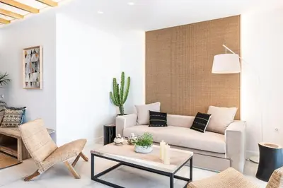 a living room with a couch and a table at Blue Island Luxury Apartment in Kato Daratso