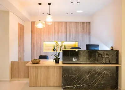 a lobby with a desk with a laptop on it at Aphrodite Beach in Kissamos