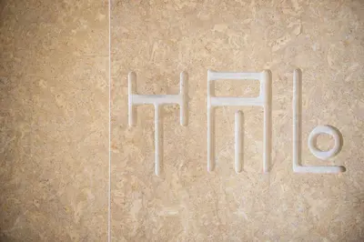 a floor with two white signs on it at Avra Apartments Kolymbari Harbour in Kolymvari