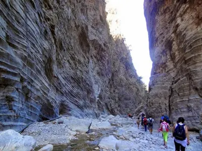 a group of people walking through a canyon at Irene's studio in chania in Chania Town