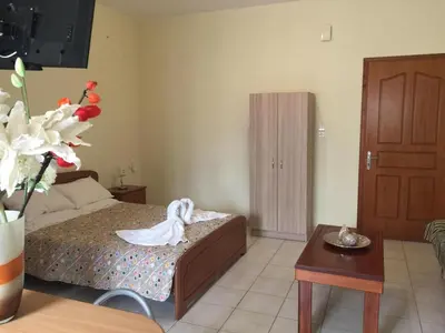 a bedroom with a bed with a swan on it at Irene's studio in chania in Chania Town