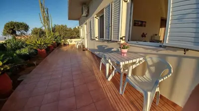 a patio with a table and chairs on a house at Maria & Zachos House in Kissamos