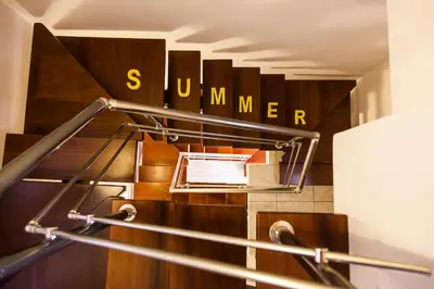 an escalator with a sign that reads sunnen at Casa Ariadne in Plataniás