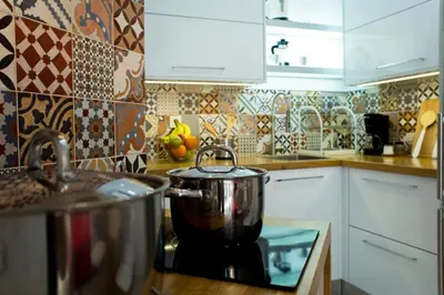 a pot sitting on top of a stove in a kitchen at Elmaya's Duplex in Kissamos