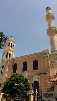 a building with a clock tower on top of it at Casa 1926 in Chania Town