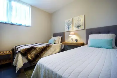 a bedroom with two beds and a window at 3 bdr apartment 5 km from the city in Agios Onoufrios