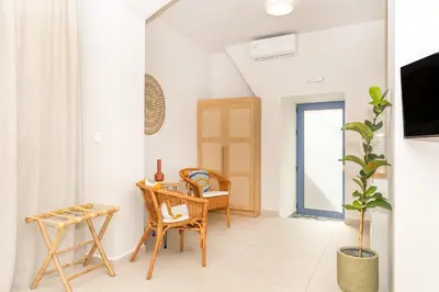 a living room with a table and chairs at Camara Residence in Chania Town