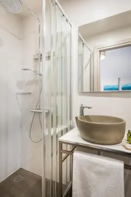 a bathroom with a sink and a shower at Camara Residence in Chania Town