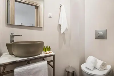 a bathroom with a sink and a toilet at Camara Residence in Chania Town