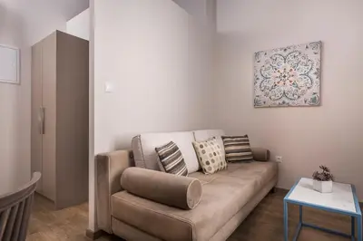 a living room with a couch and a table at Camara Residence in Chania Town