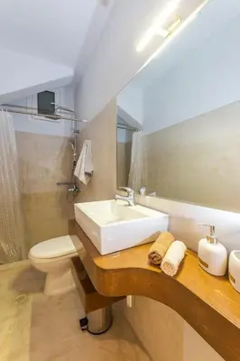 a bathroom with a sink and a toilet at Coco Studio in Chania Town